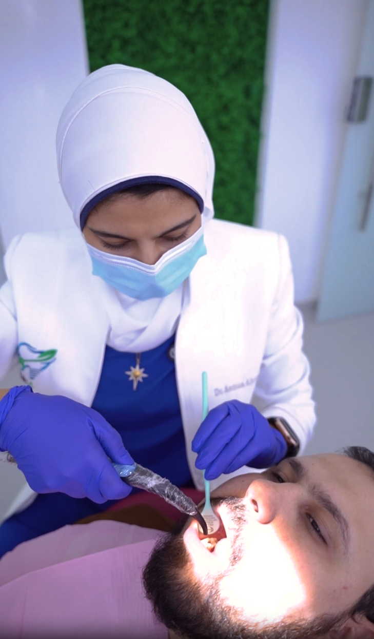 Dr. Asmaa Ahmed providing professional dental care at Triple A Dental Clinic in Al Rehab City